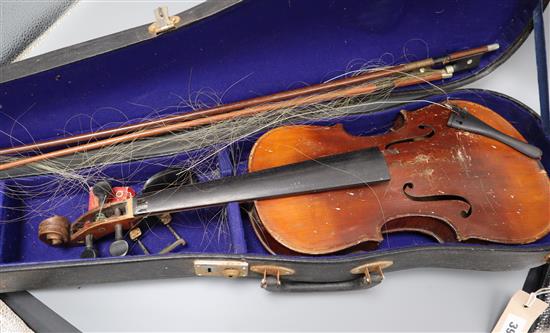 A 19th century European violin, cased with two bows